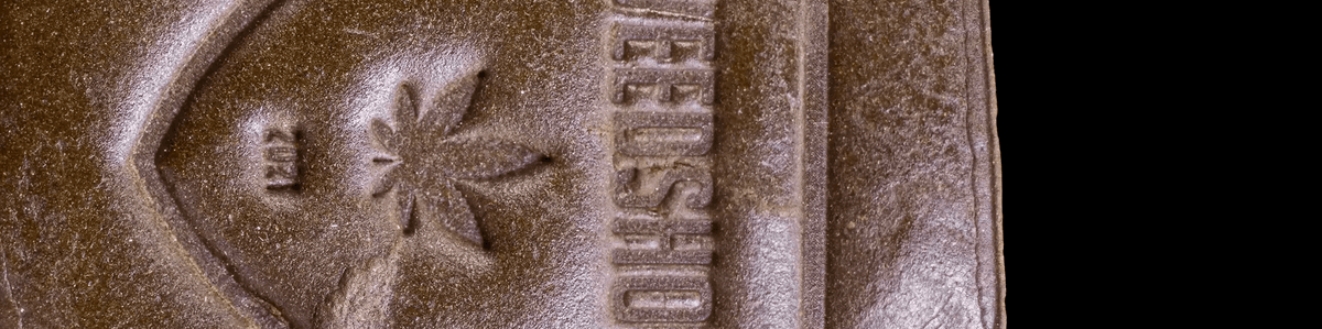 Pressed hash blocks in warm brown tones with a slightly rough, compact surface.