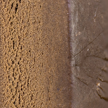 Close-up of Drysift hash showing dense pressed kief structure