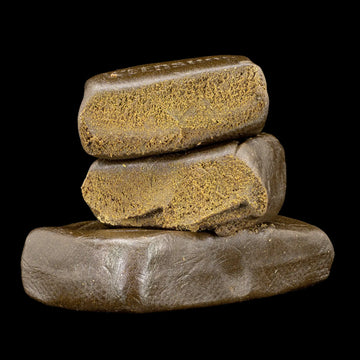 Farfar's Favorit 30% THCA glasshouse hash with dark compact texture