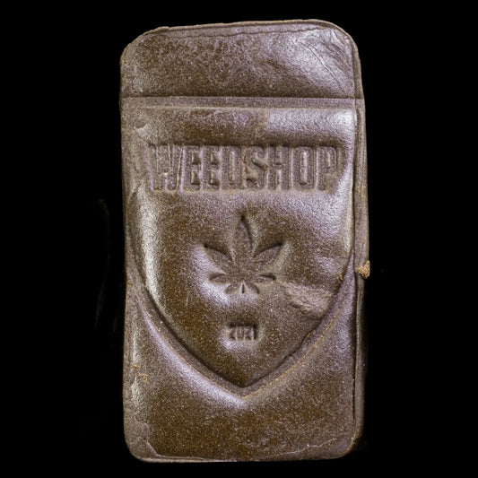 Luksus Klump 30% THCA Bubba Kush hash block with smooth dark surface