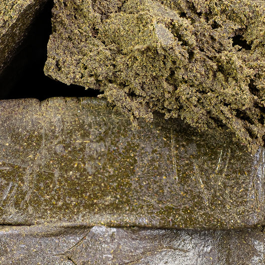 Close-up of Manali Cream THCA hash showing creamy texture and hand-pressed finish