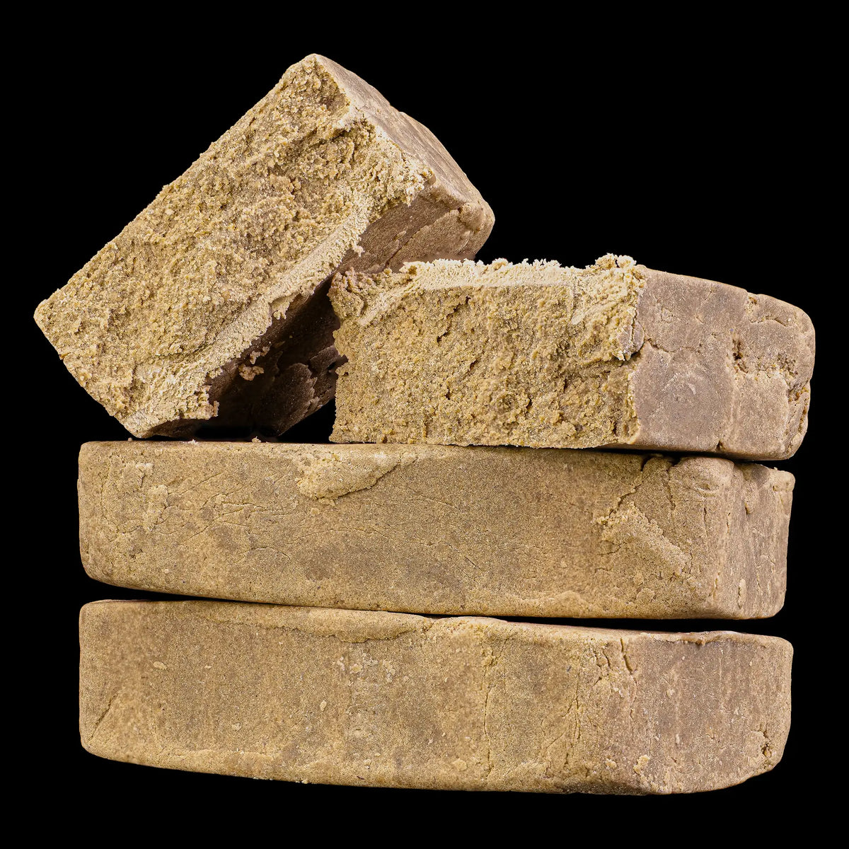Close-up of Super Pollen THCA hash showing fine pollen structure and resin-rich consistency