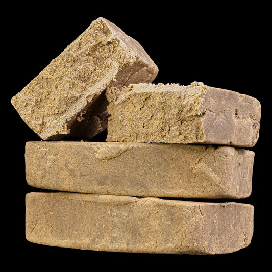 Close-up of Super Pollen THCA hash showing fine pollen structure and resin-rich consistency